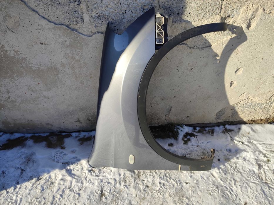 Nissan Qashqai I Lift J10 09-13r Błotnik prawy