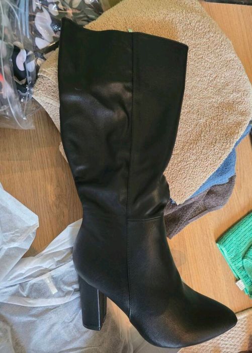 Botas de salto até o joelho