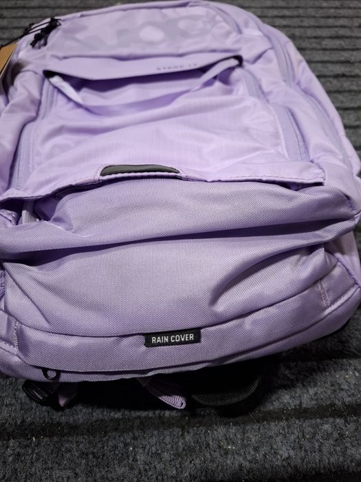 Plecak rowerowy z ochraniaczem Evoc Stage 12  rain cover fioletowy lilac one size