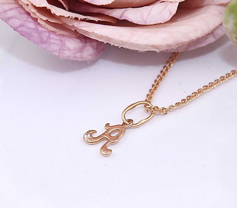 Złota zawieszka p.585/0,41g - literka "A" z cyrkonią