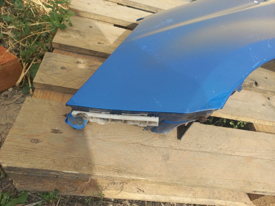 Nissan note e11 błotnik lewy przód przedni