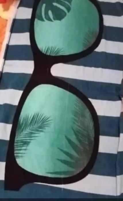 Beach towel with sunglasses