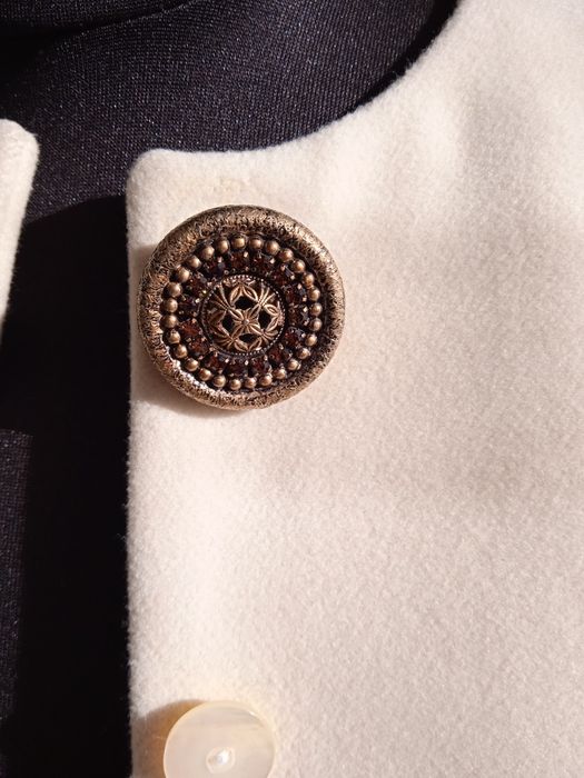 Жіноче пальто молочне