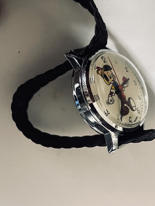 Relogio corda manual pinoquio