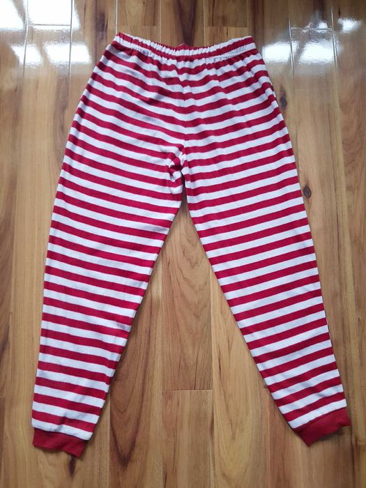 Polarowe spodnie w paski The Grinch czerwono białe Primark  M