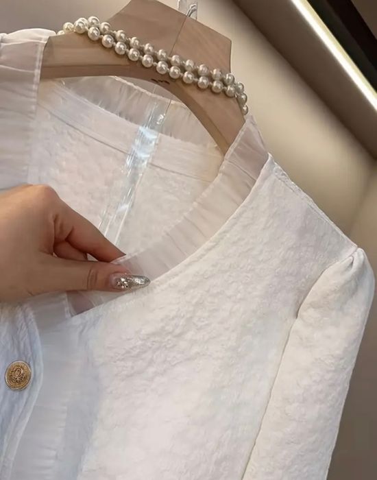 Блузка біленька..