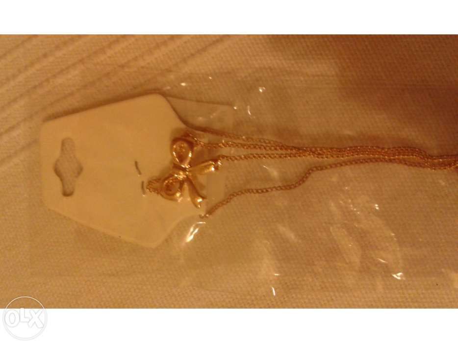 Colar Laço Dourado novo