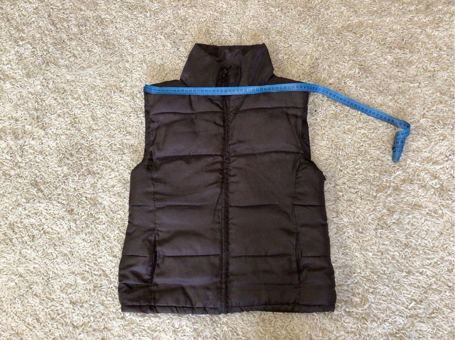 Жилетка теплая.