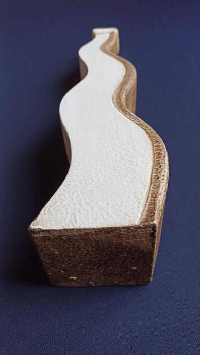 Wavy ceramic jug.64862790625026123
