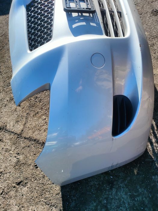 Toyota Yaris 2 II zderzak przód srebrny 1E7