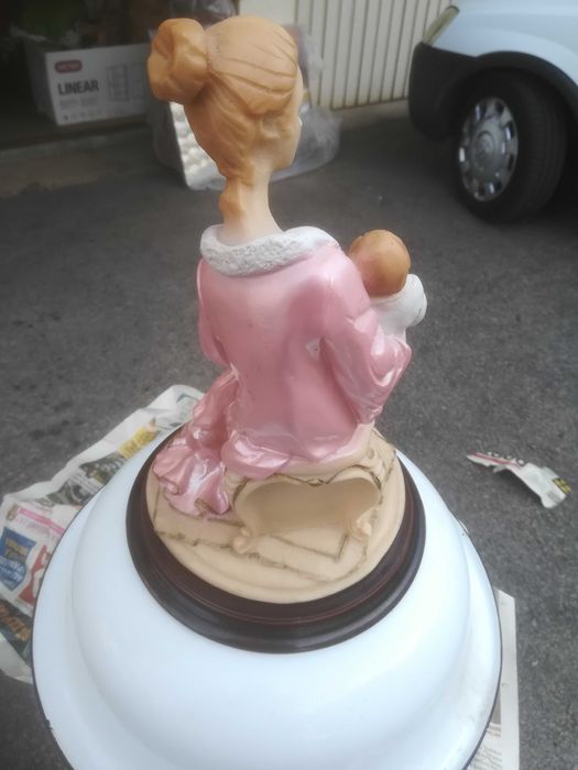 estatueta de marfinite mãe rica