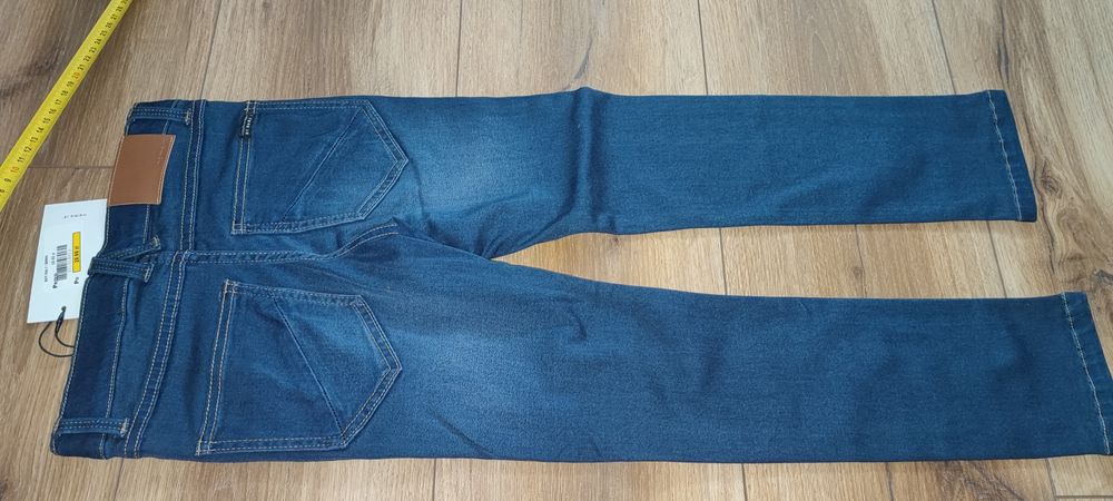 Spodnie 128 nowe jeansowe dziewczęce nr it niebieskie