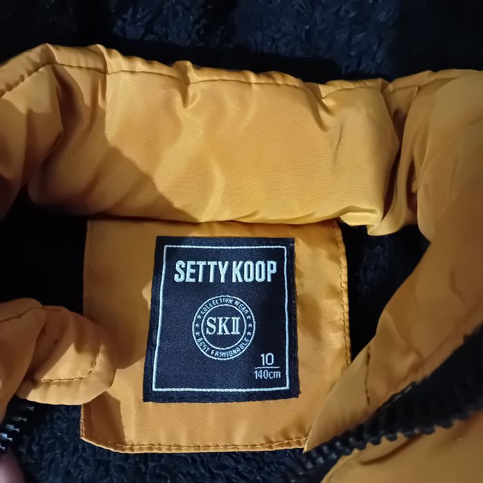 Ruda ciepła kurtka na 140 cm