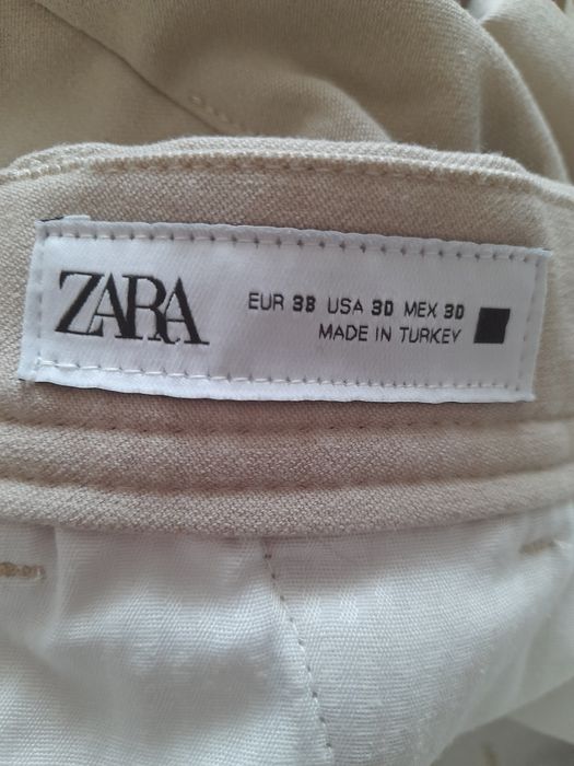 Beżowe męskie  spodnie Zara 38