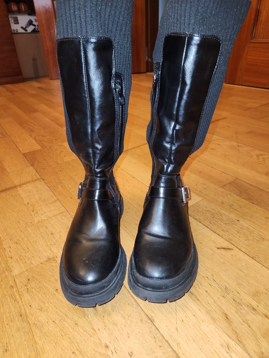 Botas pretas cano alto