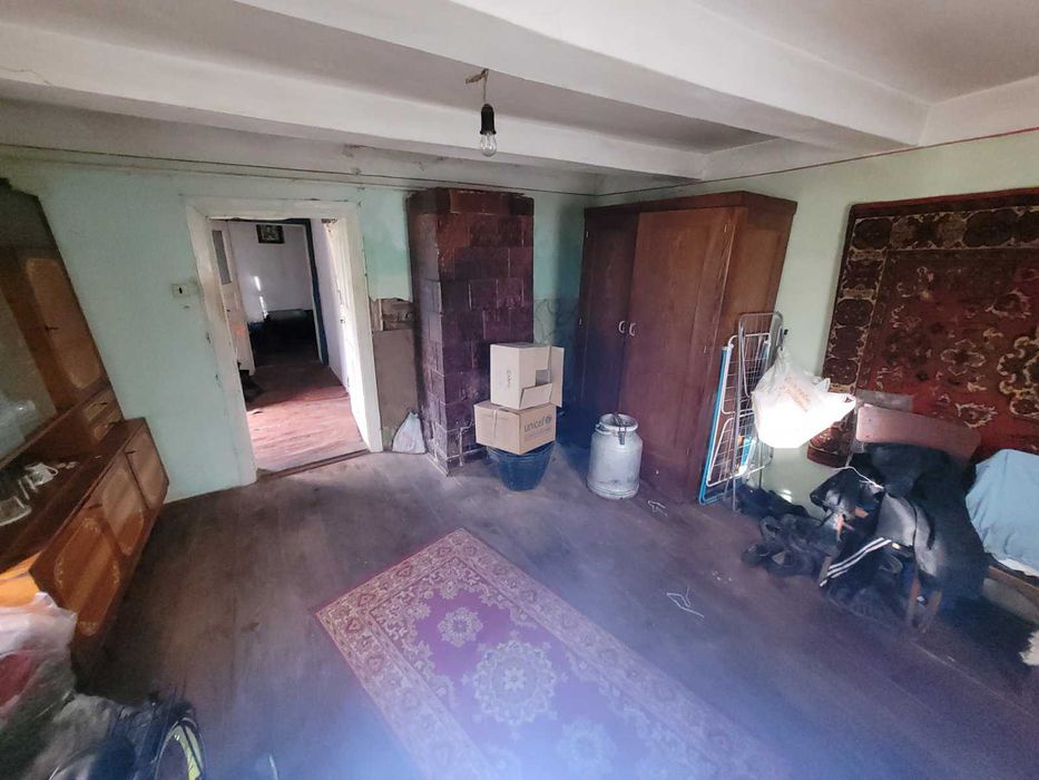 Дерев'яний будинок та земельна ділянка 14 сот. м. Кам'янка-Бузька