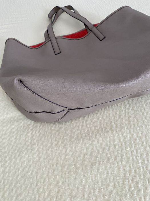 Mala reversível com pêlo vermelho