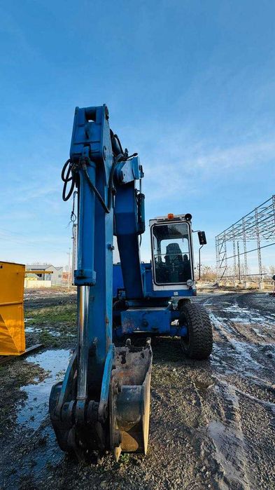 екскаватор, трактор Fuchs