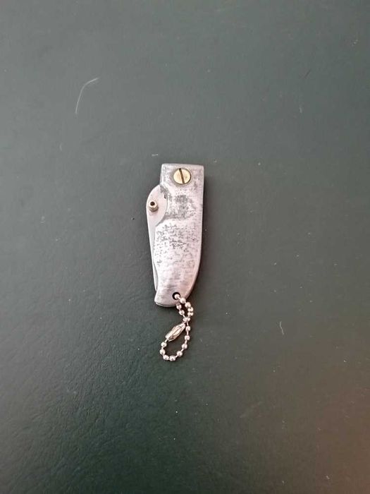 Canivete em aço inox com punho em estanho