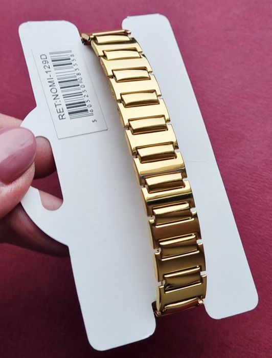 Pulseira elástica, dourada, em aço inoxidável.