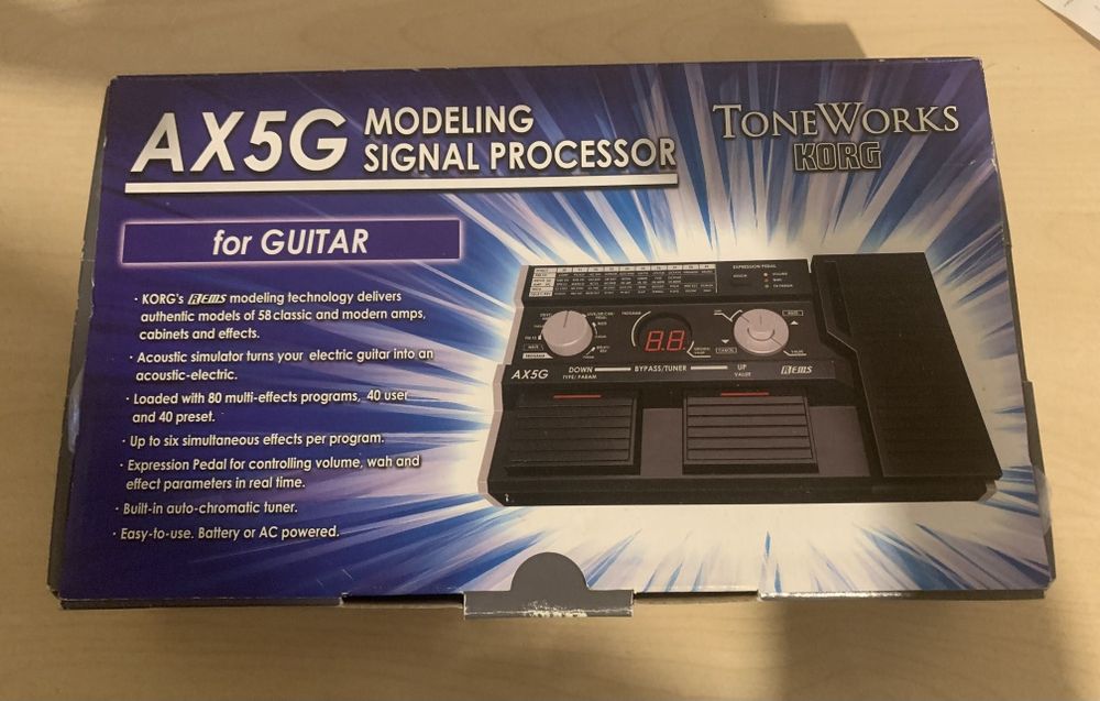 Korg AX5G em caixa