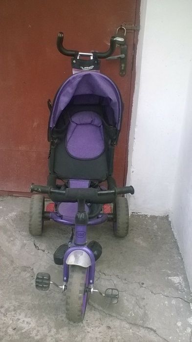 Велосипед з батьківською ручкою.