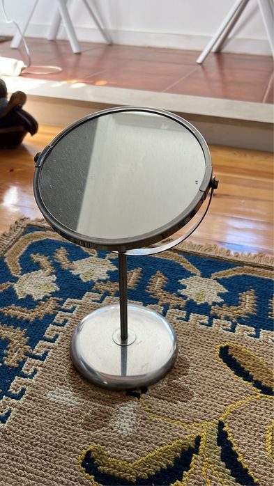 Rotating metal mirror with magnification