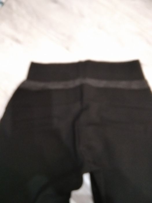Nowe materiałowe spodnie rozm s
