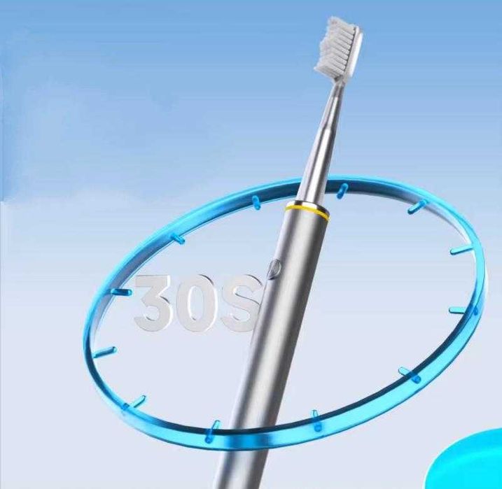 Електрична зубна щітка з USB зарядкою та 4 додатковими насадками .