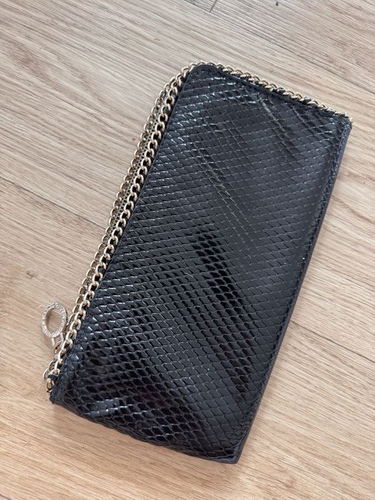 Clutch preto efeito cobra