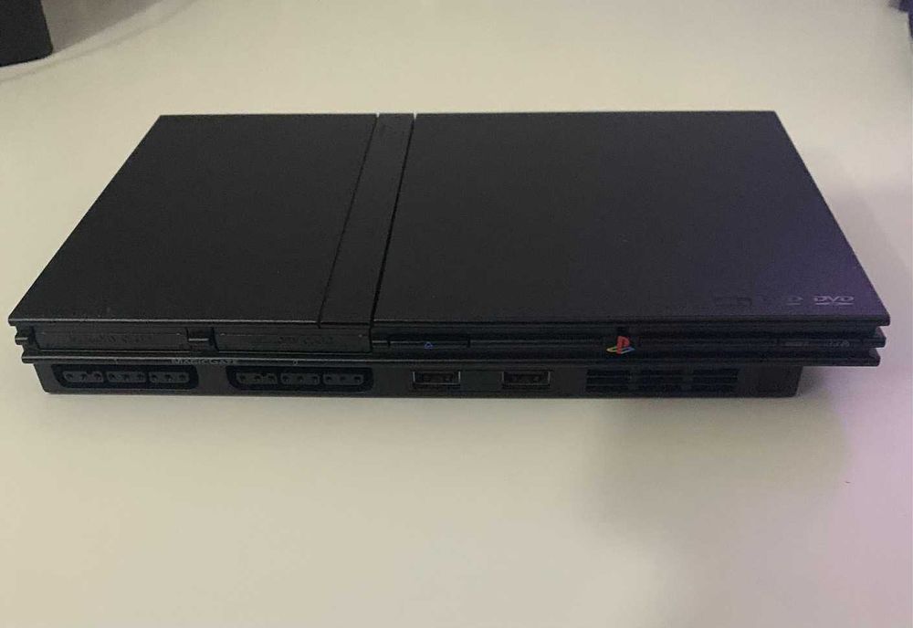 PS2 Slim com 2 comandos e 9 jogos