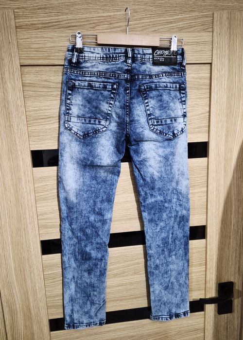 Modne jeansy spodnie dla chlopaka 152 cm wzór Reserved