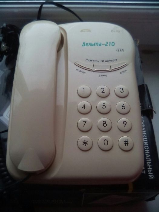 Продам телефон дельта 210