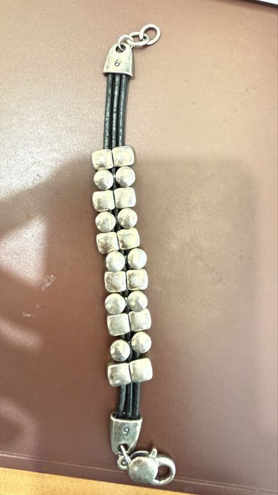Pulseira em aco e pele preta
