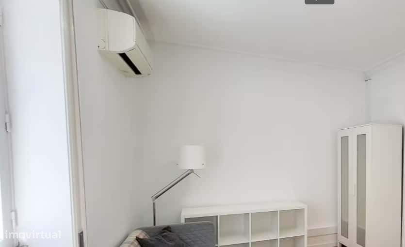 Superior room with shared bathroom and a sofa