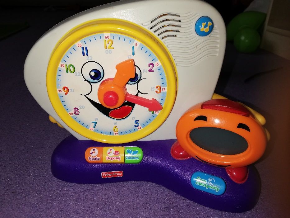 Zegar zabawka, gra, zadaje zagadka, uczy godzin Fisher Price