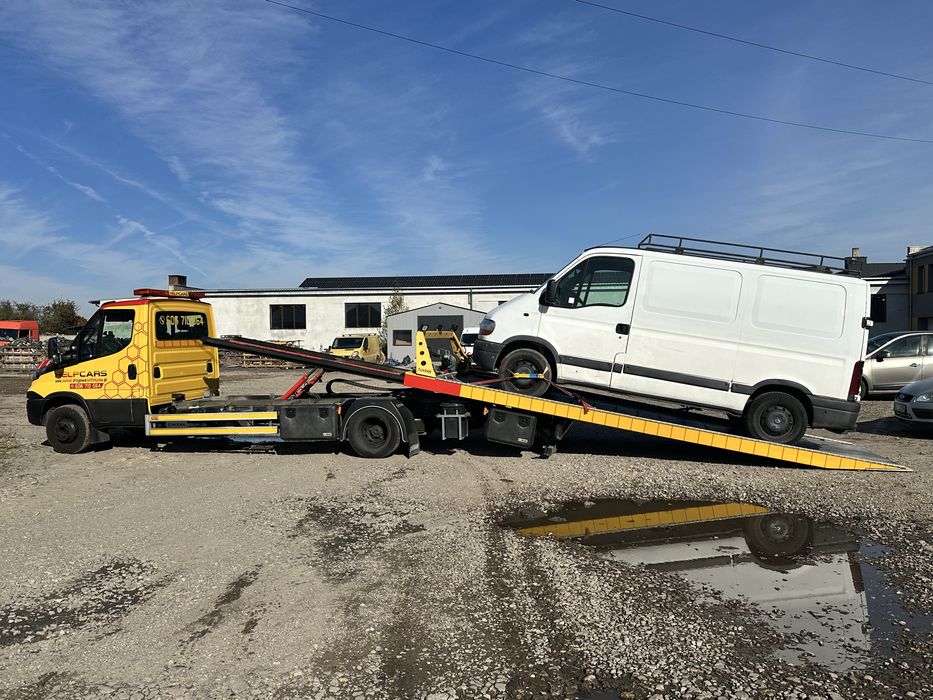 Pomoc drogowa holowanie transport maszyn przyczepa laweta autolaweta