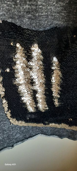 Dresowa asymetryczna  tunika z cekinową kieszenią