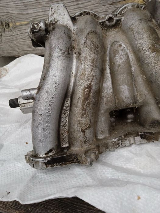 Колектор впускний ваз 2123 2107 2104