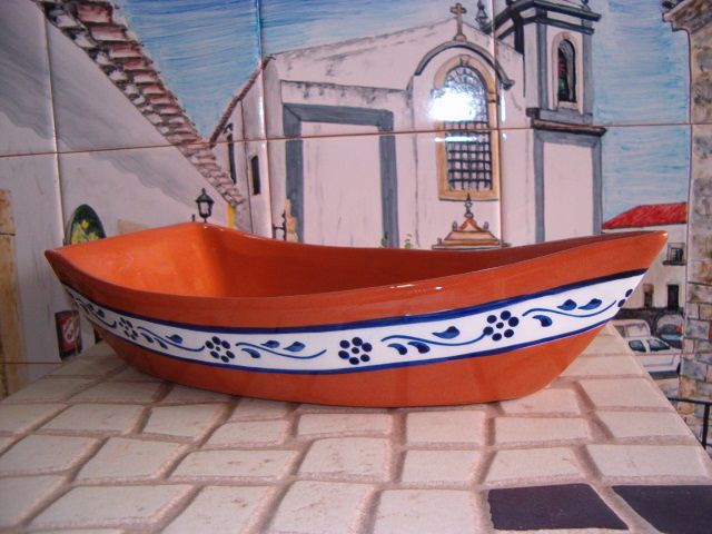 Barco em barro para marisco