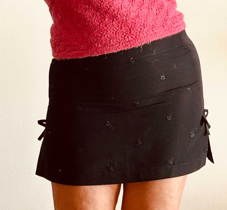 Mini saia em preto de griffe