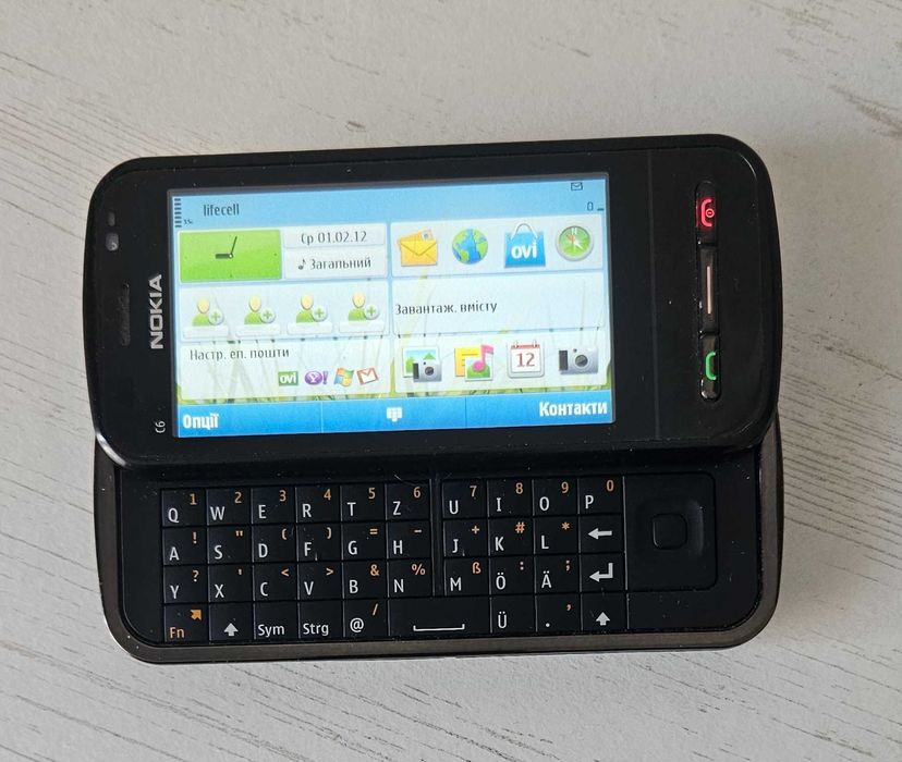 Nokia C6-00  бічний слайдер