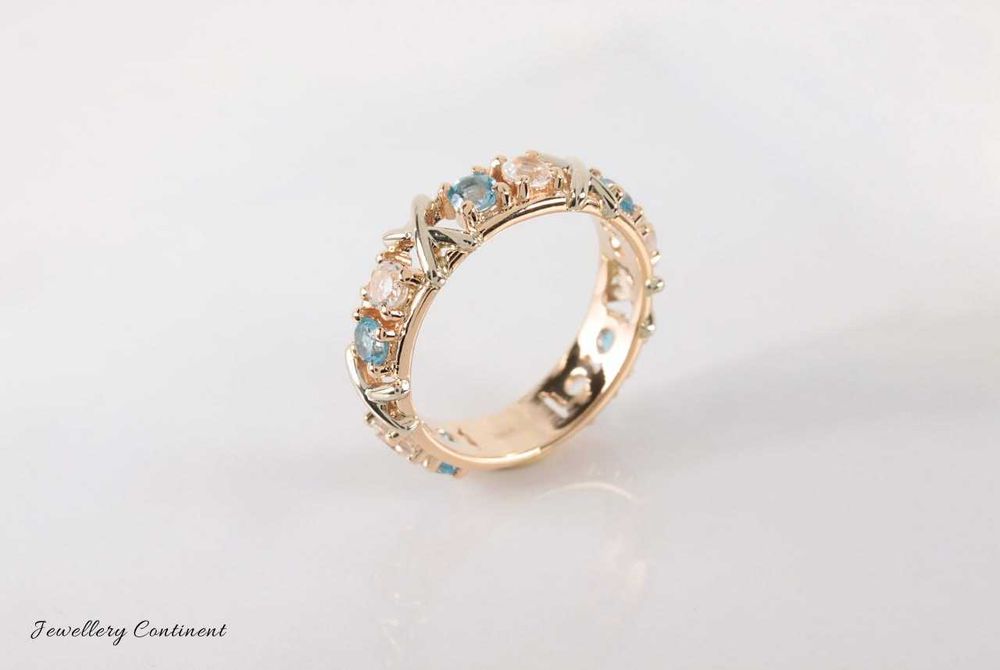 Кольцо из золота с топазами