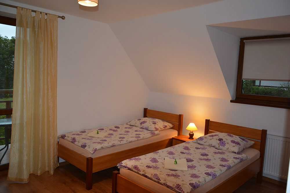 "Słoneczna Ostoja" Pokoje gościnne Apartamenty Mikołajki Mazury