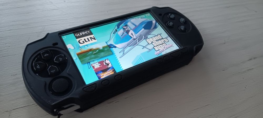 PSP(+200jogos)+protecção de silicone+bolsa