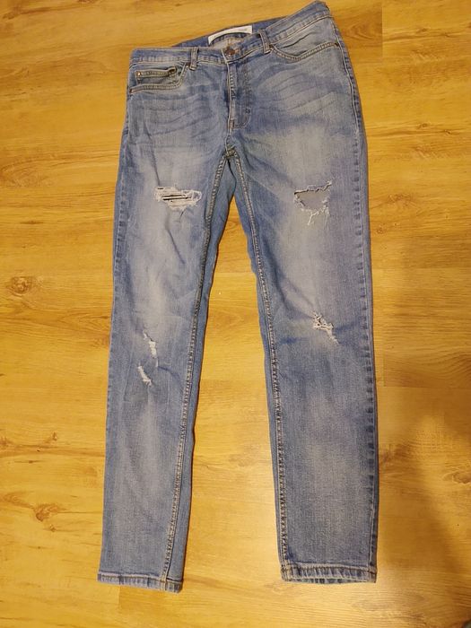 Jeansy Burton 32 SM z przetarciami