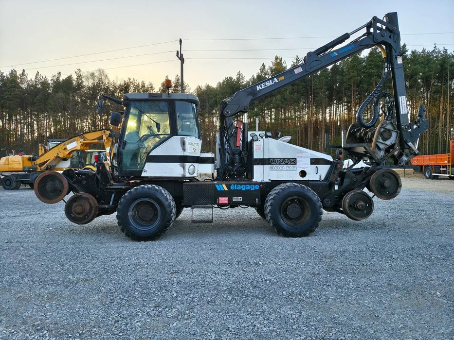Caterpillar UNAC 300RR Mulczer kolejowy Liebherr atlas dwudrogowy zw