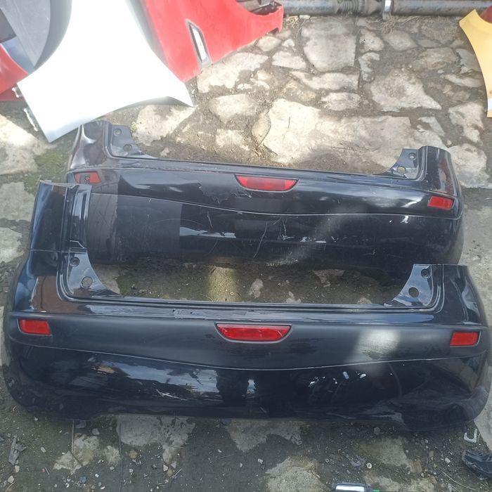 Задній бампер Ніссан ноте Nissan note