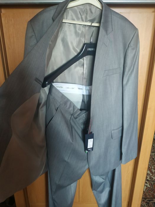 Продам новый костюм мужской на высокий рост 56 размер