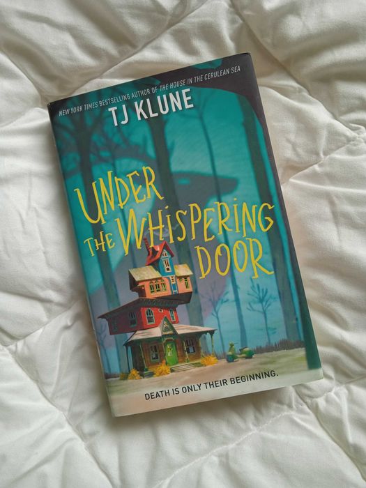 Книга Under the Whispering Door англійською
